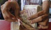 Rupee ends at 1-month low of 61.74 against the dollar