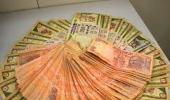 Rupee trims initial gains, still up at 60.82 Vs dollar