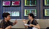 Chinese stocks rebound on share-sale ban; Hong Kong also up