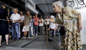 Relief and anger in Greece as Tsipras strikes deal