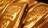 Gold extends losses; down Rs 100 on global cues, low demand