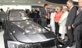 A day after biz meet in Delhi, Modi, Merkel visit Bosch facility