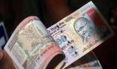 Rupee weakens further to 67.48, ends down 17 paise