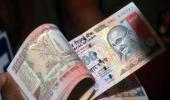 Rupee snaps 3-day winning spree, down 6 paise to 67.11