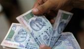 Rupee tumbles 20 paise on buoyant dollar, capital outflows