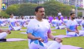 In pix: Adani, Sitharaman strike a yoga pose