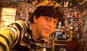 Whose posters do SRK, Salman paste on their walls?