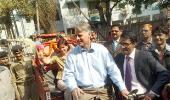 Image: American envoy rides a cycle rickshaw