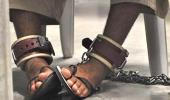 Guantanamo: Justice paused, shackled