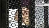 In a cage, Mubarak faces trial for murder