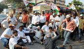 PIX: NCP workers take to the streets to protest attack on Pawar