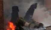 US Military jet crashes into apartment complex