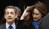 Sarkozy's fingers crossed as polls begin in France