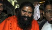 Man throws black ink at Ramdev, roughed up