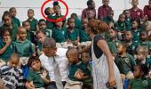 PIC: Kissing boy steals Obama's photo-op moment