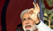 Modi takes a dig at PM over FDI in retail