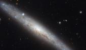 NASA captures pictures of dusty spiral galaxy