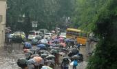 In PHOTOS: Mumbai slows down as rains hit road, rail traffic