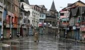 Curfew in various J-K districts; army stages flag march