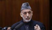 Karzai arrives in India; to seek military aid