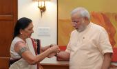 PHOTO: Anandiben Patel ties rakhi to Modi