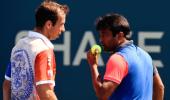 Paes, Sania toil before progressing at US Open