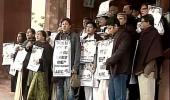 Wearing black shawls, Trinamool MPs protest outside Parliament