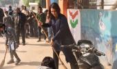 US Congresswoman Tulsi swept up in Modi's Clean India