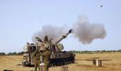 Gaza bombardment continues, Israeli tanks at border