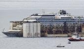 Costa Concordia completes final voyage to scrap yard