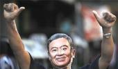 Thai junta challenges Thaksin to return, fight legal charges