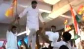 BJP leader WALKS over young boys. BOO him!