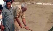 Modi cleans Assi Ghat, nominates UP CM, 8 others for Swachh Bharat