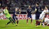 Euro qualifier: Mueller double helps Germany edge past Scotland