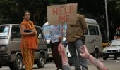 Help! Is this woman drowning in Bengaluru's pothole?