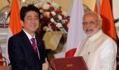 Modi, Japan's Shinzo Abe put bullet train on track, sign defence agreements