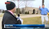 Reporter sees bank robbery on live TV