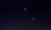 Photos: Eiffel Tower goes dark for Charlie Hebdo