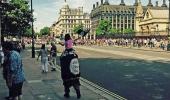 Man, child wave Islamic State flag outside UK Parliament