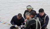 Over 400 missing hours after Chinese ship sinks, captain held