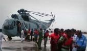 Navy saves 20 people from listing vessel in dramatic rescue ops