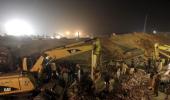 Workers trapped in Pakistan factory plead for help on cellphones