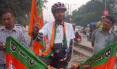 The handicapped cyclist who campaigns for Modi