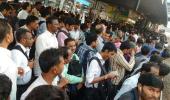 PHOTOS: Mumbai hassled with train delays, traffic snarls for second day