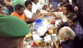 PHOTOS: PM Modi snacks with workers in Saudi and much, much more