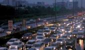 PHOTOS: Water-logged Delhi battles with slow traffic