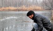 PIX: Freezing cold leaves Kashmir shivering