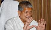 Rebel Uttarakhand MLAs reach Delhi, Rawat warns of action