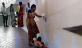 Denied stretcher, woman drags husband on hospital ramp