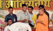 Adityanath draws flak for sharing stage with murder-accused MLA